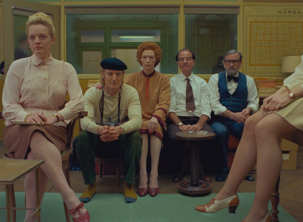 (From L-R): Elisabeth Moss, Owen Wilson, Tilda Swinton, Fisher Stevens and Griffin Dunne in the film THE FRENCH DISPATCH. Photo Courtesy of  Searchlight Pictures. © 2020 Twentieth Century Fox Film Corporation All Rights Reserved